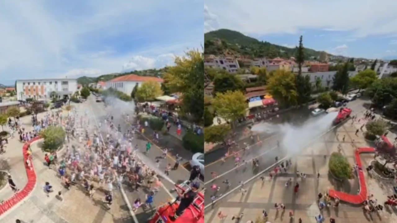 Vapa ekstreme, zjarrfikësit freskojnë qendrën e Gramshit: Fëmijët i gëzohen “shiut” nga autoboti
